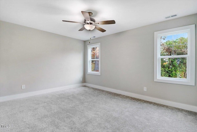 1201 Crawford St S, Wilson, NC 27893 - carpeted empty room with plenty of natural light and ceiling fan
