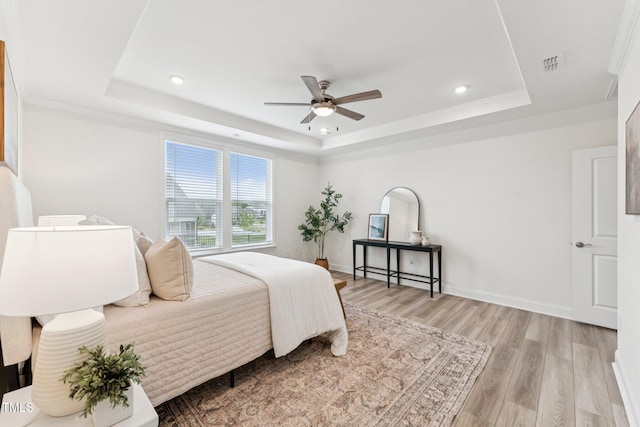 1625 Plover Cir, Fuquay Varina, NC 27526 - bedroom with a raised ceiling, light wood finished floors, recessed lighting, a ceiling fan, and ornamental molding