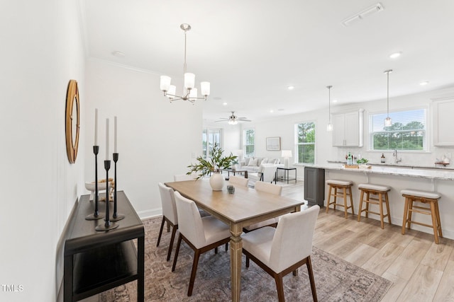 1625 Plover Cir, Fuquay Varina, NC 27526 - dining room featuring a chandelier, recessed lighting, light wood-type flooring, and a ceiling fan