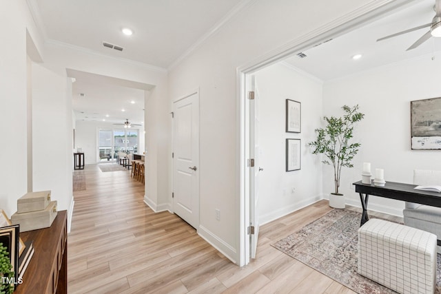 1625 Plover Cir, Fuquay Varina, NC 27526 - corridor with light wood finished floors, crown molding, and recessed lighting
