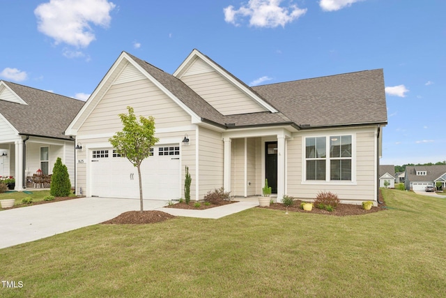 1625 Plover Cir, Fuquay Varina, NC 27526 - view of front facade with concrete driveway, a front lawn, a garage, and a shingled roof