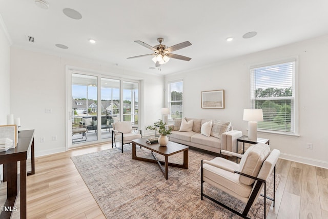 1625 Plover Cir, Fuquay Varina, NC 27526 - living room with crown molding, light wood-style flooring, a ceiling fan, and recessed lighting