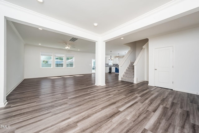 171 Piney Field Rd, Fuquay Varina, NC 27526 - unfurnished living room featuring wood finished floors, stairway, crown molding, recessed lighting, and a chandelier