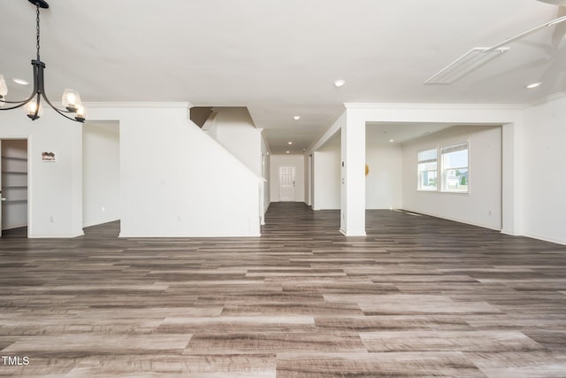 171 Piney Field Rd, Fuquay Varina, NC 27526 - unfurnished living room featuring wood finished floors, stairs, a chandelier, and recessed lighting
