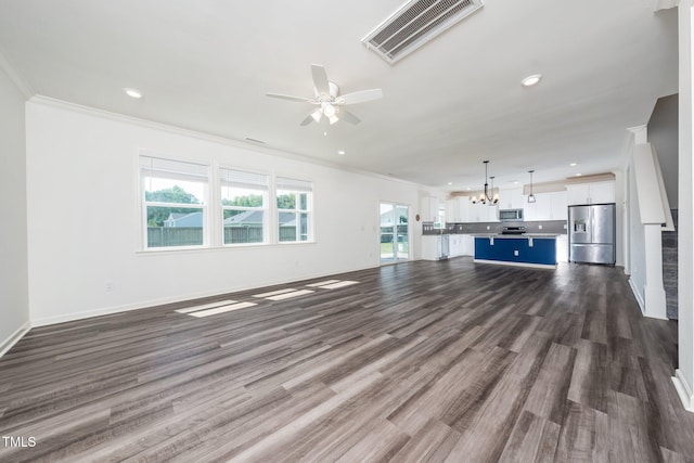 171 Piney Field Rd, Fuquay Varina, NC 27526 - unfurnished living room featuring crown molding, ceiling fan, a chandelier, dark wood-style floors, and recessed lighting