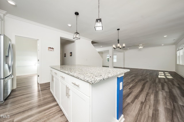 171 Piney Field Rd, Fuquay Varina, NC 27526 - kitchen featuring stainless steel fridge, a center island, wood finished floors, decorative light fixtures, and recessed lighting