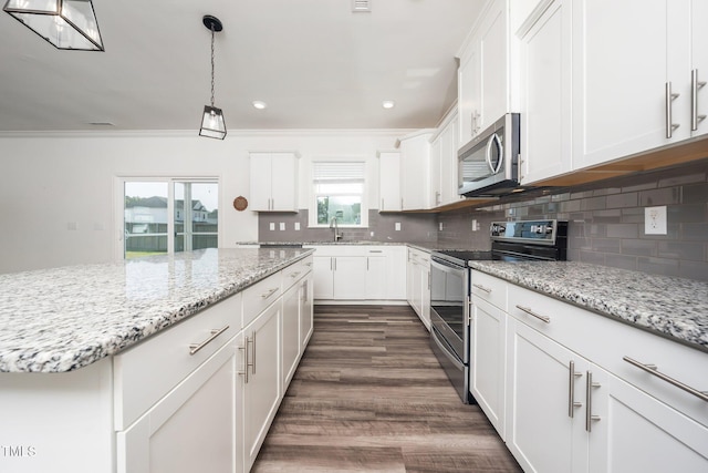 171 Piney Field Rd, Fuquay Varina, NC 27526 - kitchen featuring stainless steel appliances, white cabinets, decorative backsplash, dark wood-style flooring, and decorative light fixtures