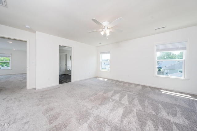 171 Piney Field Rd, Fuquay Varina, NC 27526 - unfurnished bedroom featuring carpet floors, baseboards, multiple windows, and ceiling fan