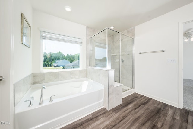 171 Piney Field Rd, Fuquay Varina, NC 27526 - bathroom with a bath, a shower stall, wood finished floors, and recessed lighting