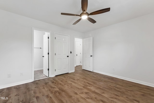 129 Assembly Ct, Cary, NC 27511 - unfurnished bedroom featuring baseboards and wood finished floors