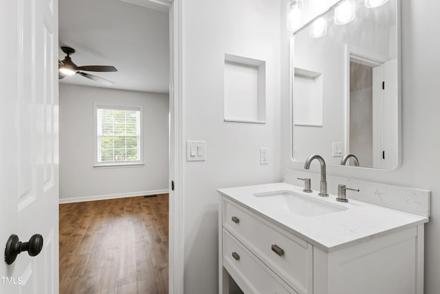 129 Assembly Ct, Cary, NC 27511 - bathroom featuring vanity, wood finished floors, a ceiling fan, and baseboards