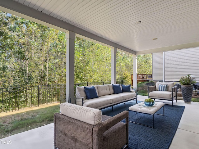 view of patio featuring an outdoor living space and a fenced backyard