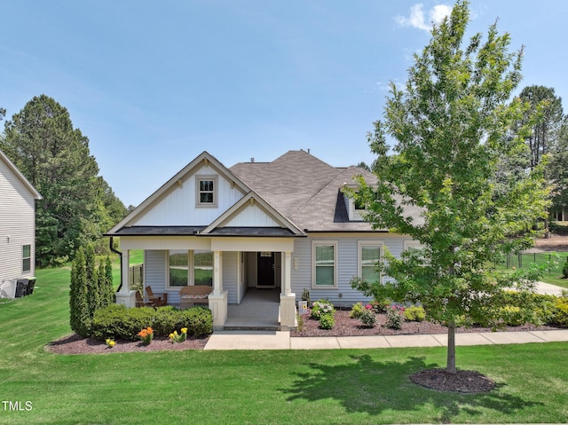 475 Long View Dr, Franklinton, NC 27525 - view of front of property with a porch, a front lawn, central air condition unit, roof with shingles, and board and batten siding