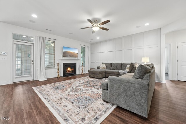 475 Long View Dr, Franklinton, NC 27525 - living area with a decorative wall, a ceiling fan, dark wood-style floors, a fireplace with flush hearth, and recessed lighting
