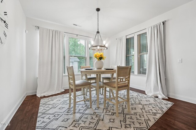 475 Long View Dr, Franklinton, NC 27525 - dining space with a chandelier, wood finished floors, and baseboards