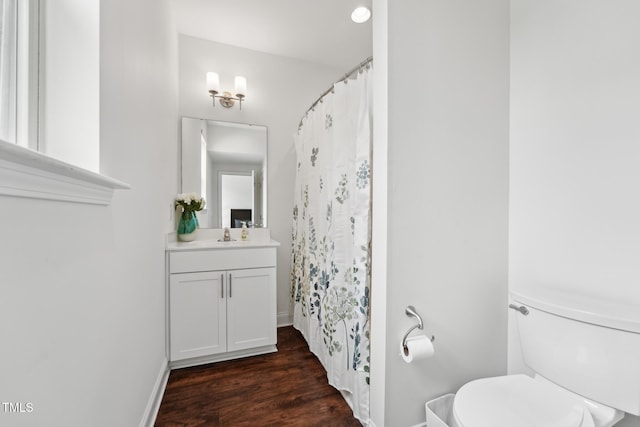 475 Long View Dr, Franklinton, NC 27525 - full bathroom featuring vanity, toilet, wood finished floors, curtained shower, and baseboards