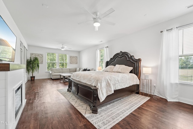 475 Long View Dr, Franklinton, NC 27525 - bedroom with wood finished floors, a fireplace, baseboards, and ceiling fan