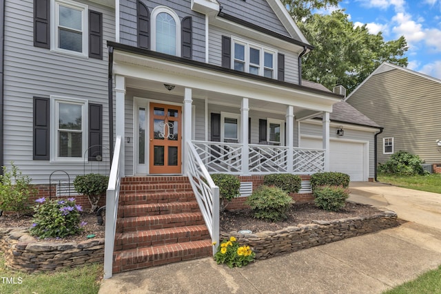 2721 Dahlgreen Rd, Raleigh, NC 27615 - view of front of property featuring a porch, driveway, central AC, and a garage