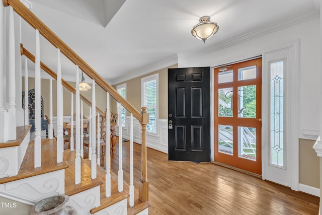 2721 Dahlgreen Rd, Raleigh, NC 27615 - foyer with crown molding, stairway, wood finished floors, and a wainscoted wall