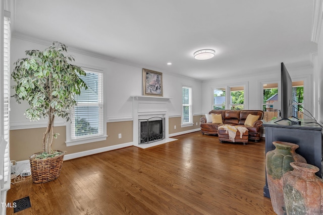 2721 Dahlgreen Rd, Raleigh, NC 27615 - living area featuring crown molding, wood finished floors, a high end fireplace, and baseboards