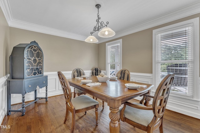2721 Dahlgreen Rd, Raleigh, NC 27615 - dining space with plenty of natural light, a wainscoted wall, crown molding, wood finished floors, and a decorative wall