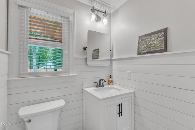 2721 Dahlgreen Rd, Raleigh, NC 27615 - bathroom featuring ornamental molding, toilet, vanity, and wooden walls