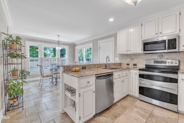 2721 Dahlgreen Rd, Raleigh, NC 27615 - kitchen with appliances with stainless steel finishes, a sink, a peninsula, white cabinetry, and crown molding