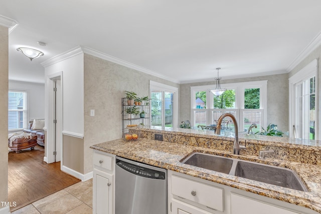2721 Dahlgreen Rd, Raleigh, NC 27615 - kitchen featuring dishwasher, a sink, crown molding, plenty of natural light, and light stone countertops