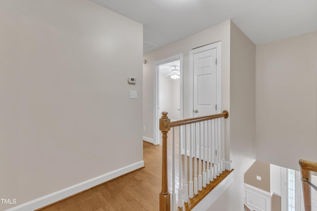 2721 Dahlgreen Rd, Raleigh, NC 27615 - hallway with an upstairs landing, light wood-style floors, and baseboards