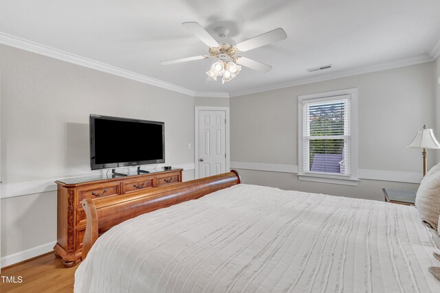 2721 Dahlgreen Rd, Raleigh, NC 27615 - bedroom with ornamental molding, wood finished floors, ceiling fan, and baseboards