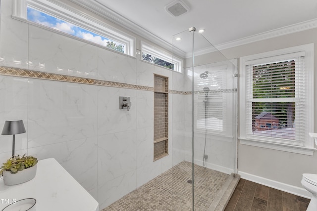 2721 Dahlgreen Rd, Raleigh, NC 27615 - full bath featuring crown molding, tiled shower, wood finished floors, toilet, and baseboards