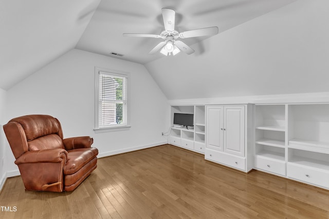 2721 Dahlgreen Rd, Raleigh, NC 27615 - unfurnished room featuring wood finished floors, lofted ceiling, built in shelves, a ceiling fan, and baseboards