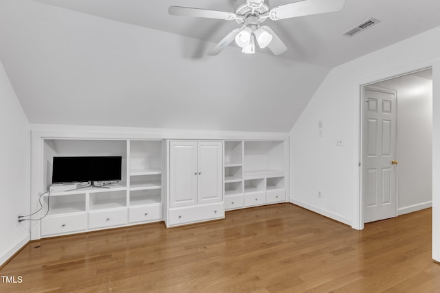 2721 Dahlgreen Rd, Raleigh, NC 27615 - additional living space with vaulted ceiling, light wood-type flooring, a ceiling fan, built in shelves, and baseboards