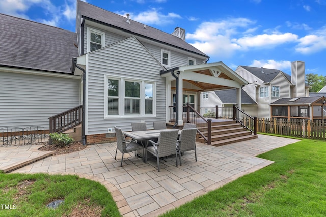 2721 Dahlgreen Rd, Raleigh, NC 27615 - rear view of house featuring a patio and a chimney