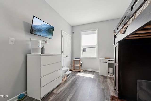 2620 Holloway St, Durham, NC 27703 - bedroom featuring dark wood-style flooring and baseboards