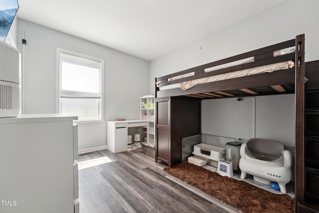 2620 Holloway St, Durham, NC 27703 - bedroom with wood finished floors and baseboards