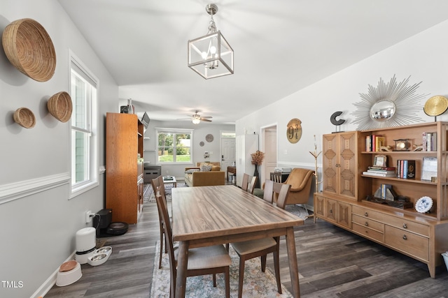 2620 Holloway St, Durham, NC 27703 - dining space with dark wood finished floors, ceiling fan, and baseboards