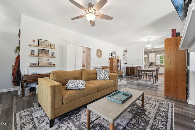 2620 Holloway St, Durham, NC 27703 - living room with ceiling fan, wood finished floors, and baseboards