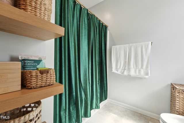 2620 Holloway St, Durham, NC 27703 - bathroom with toilet, baseboards, and a shower with curtain