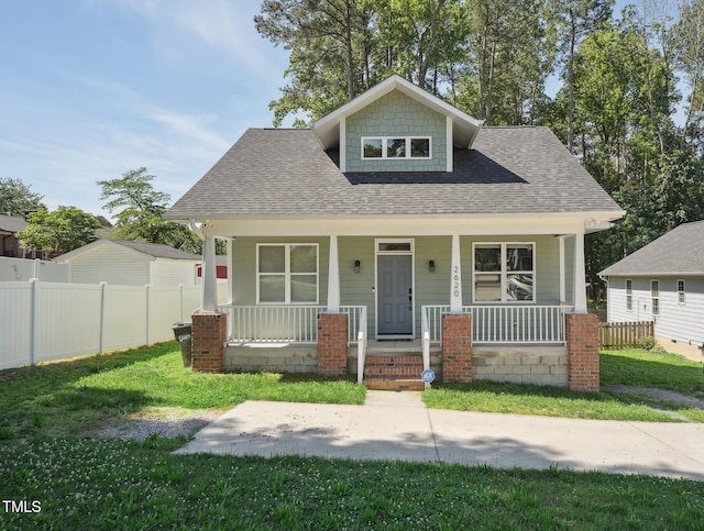2620 Holloway St, Durham, NC 27703 - bungalow-style home featuring roof with shingles and a porch