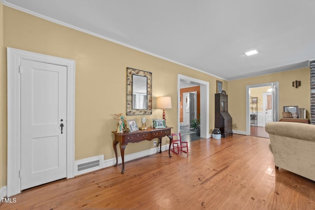 1605 Longview Ave, Tarboro, NC 27886 - living room with light wood-type flooring, ornamental molding, and baseboards