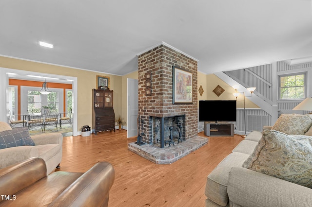 1605 Longview Ave, Tarboro, NC 27886 - living area featuring wood finished floors, a fireplace, healthy amount of natural light, and baseboards