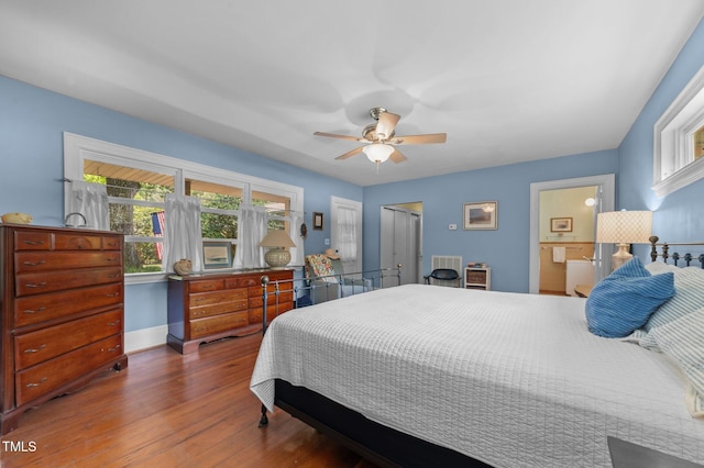 1605 Longview Ave, Tarboro, NC 27886 - bedroom with multiple windows, wood finished floors, baseboards, and a closet