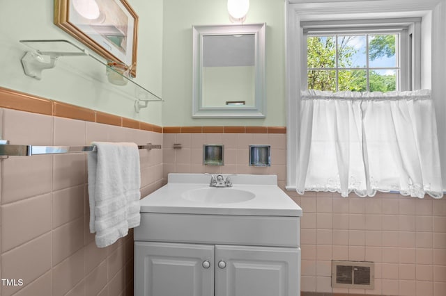 1605 Longview Ave, Tarboro, NC 27886 - bathroom with tile walls, vanity, and a wainscoted wall