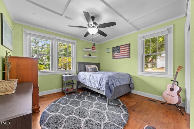 1605 Longview Ave, Tarboro, NC 27886 - bedroom featuring baseboards, wood-type flooring, ornamental molding, and a ceiling fan