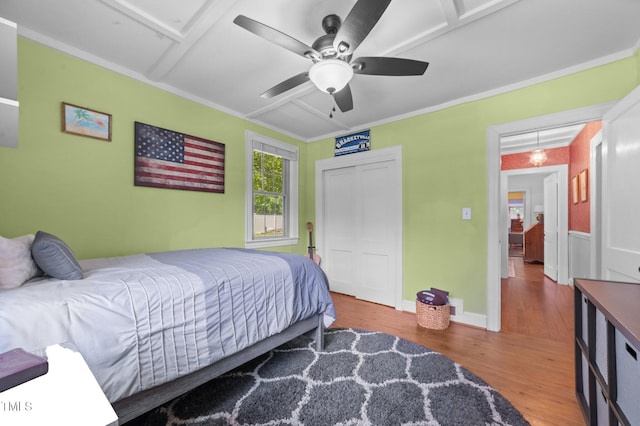 1605 Longview Ave, Tarboro, NC 27886 - bedroom featuring wood finished floors, attic access, ceiling fan, a closet, and ornamental molding