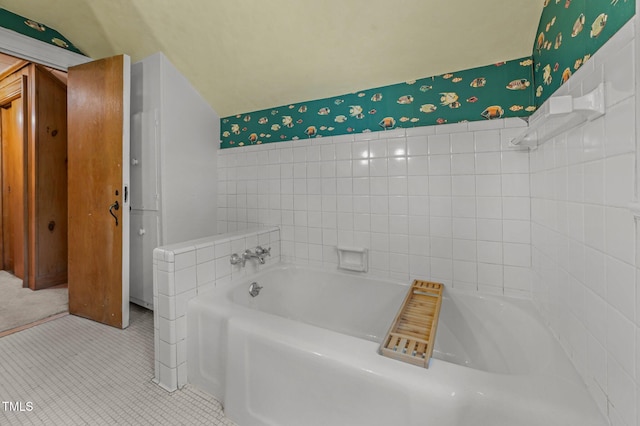 1605 Longview Ave, Tarboro, NC 27886 - bathroom featuring wallpapered walls, a bath, and tile patterned floors