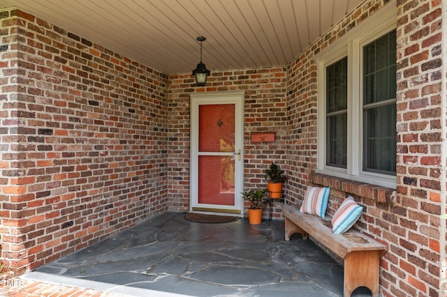 1605 Longview Ave, Tarboro, NC 27886 - doorway to property featuring brick siding and a patio