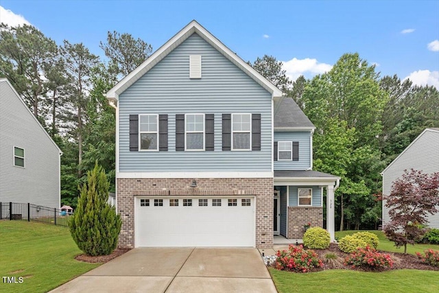 320 Everly Mist Way, Wake Forest, NC 27587 - view of front of property featuring brick siding, an attached garage, and concrete driveway