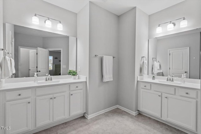 320 Everly Mist Way, Wake Forest, NC 27587 - bathroom featuring two vanities and baseboards